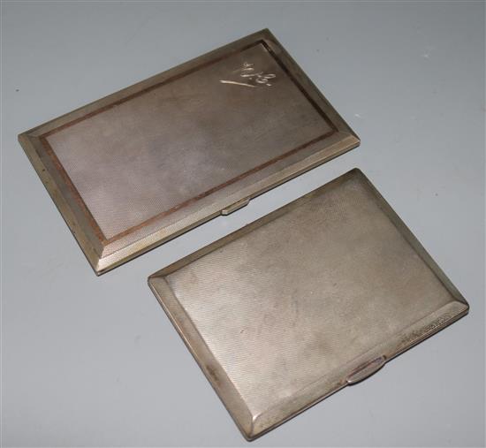 Two engine turned silver cigarette cases, gross 13 oz.